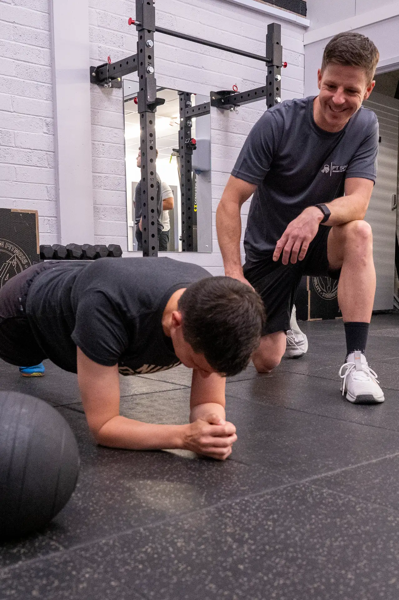 a man doing push ups in a gym